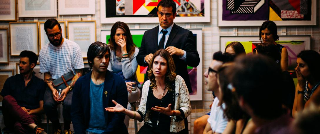People in a group talking. Photo by Antenna on Unsplash
