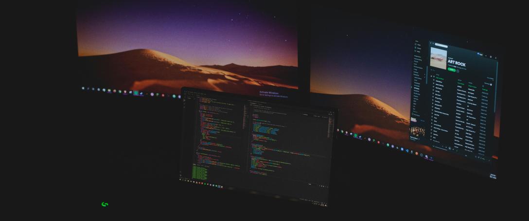 Computer monitors with data on them. Photo by David Schultz on Unsplash