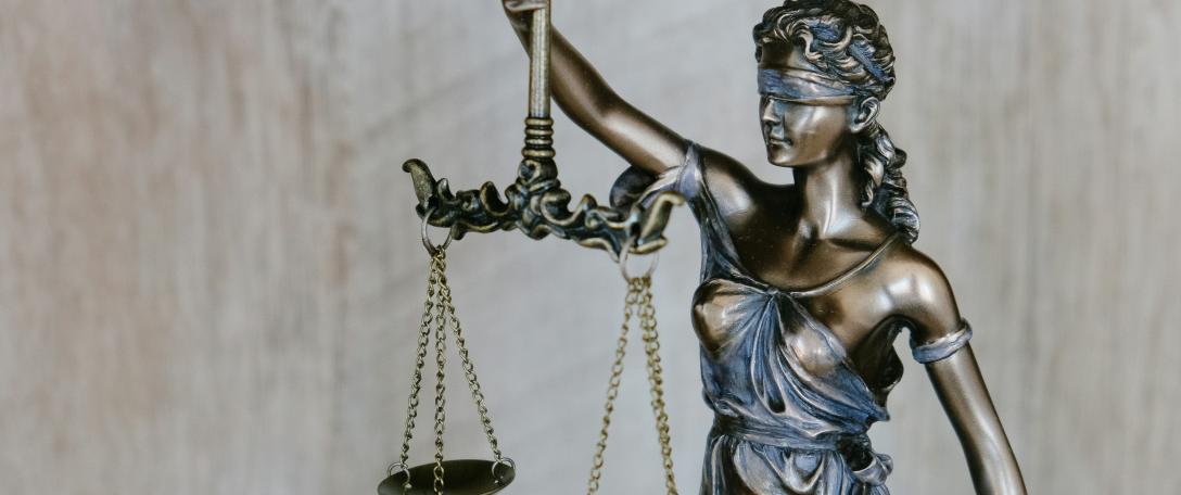 Photo of Lady Justice. Photo by Tingey Injury Law Firm on Unsplash 