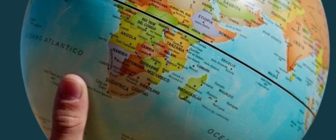 Hand holding a globe
