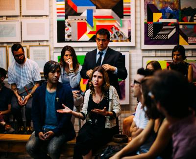 People in a group talking. Photo by Antenna on Unsplash