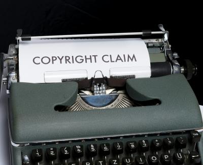 Photo of a typewriter with paper on it with the words "copyright claim". Photo by Markus Winkler on Unsplash