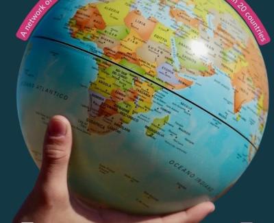 Hand holding a globe